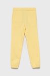 Дитячі штани Name it колір жовтий гладке