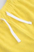 Дитячі шорти Coccodrillo колір жовтий однотонні регульована талія (3177090)
